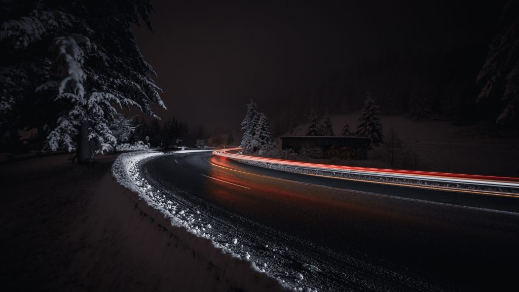 A road with light trails at night