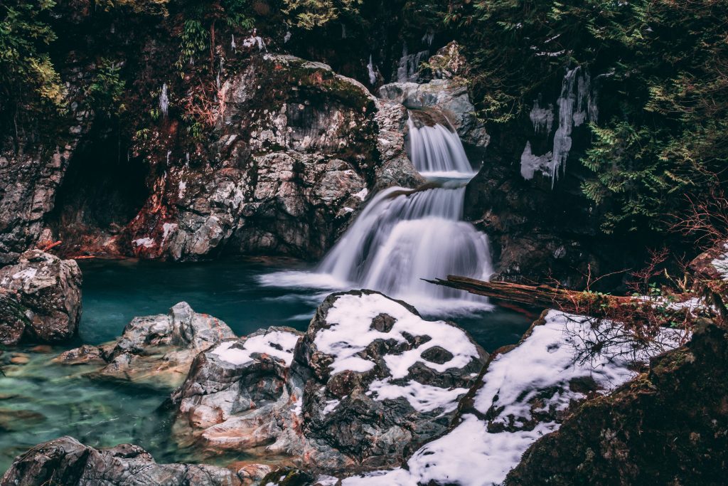 A spring flows down through the rocks