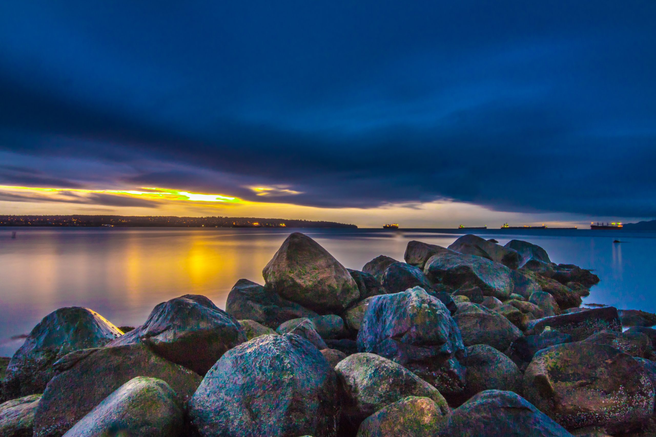 Golden color sunlight on rocks and water scaled