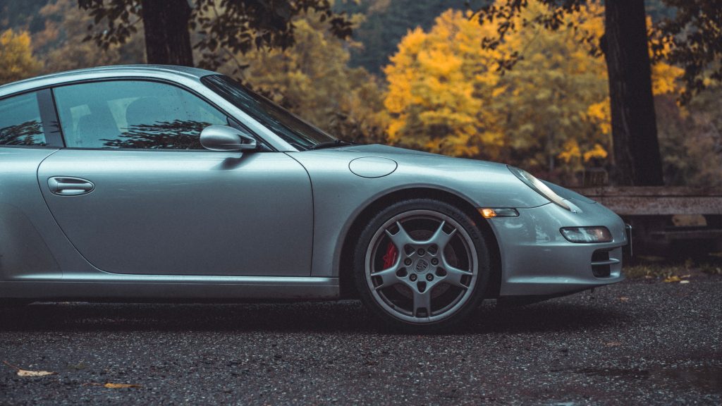 Gray car passing the road