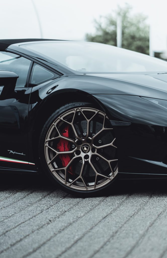 Close up wheels Lamborghini Huracan in the city street.