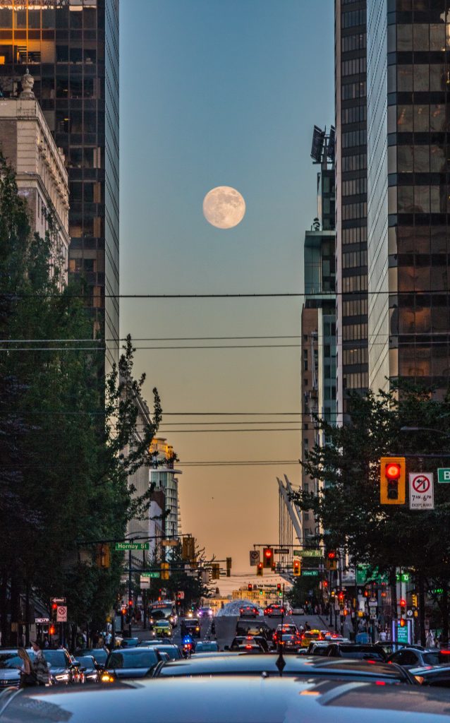 The beautiful appearance of the moon blocking the road traffic