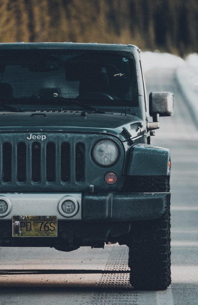 Black jeep wrangler on road