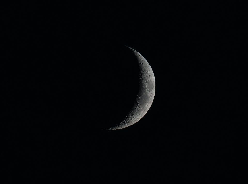 Moon in dark night sky